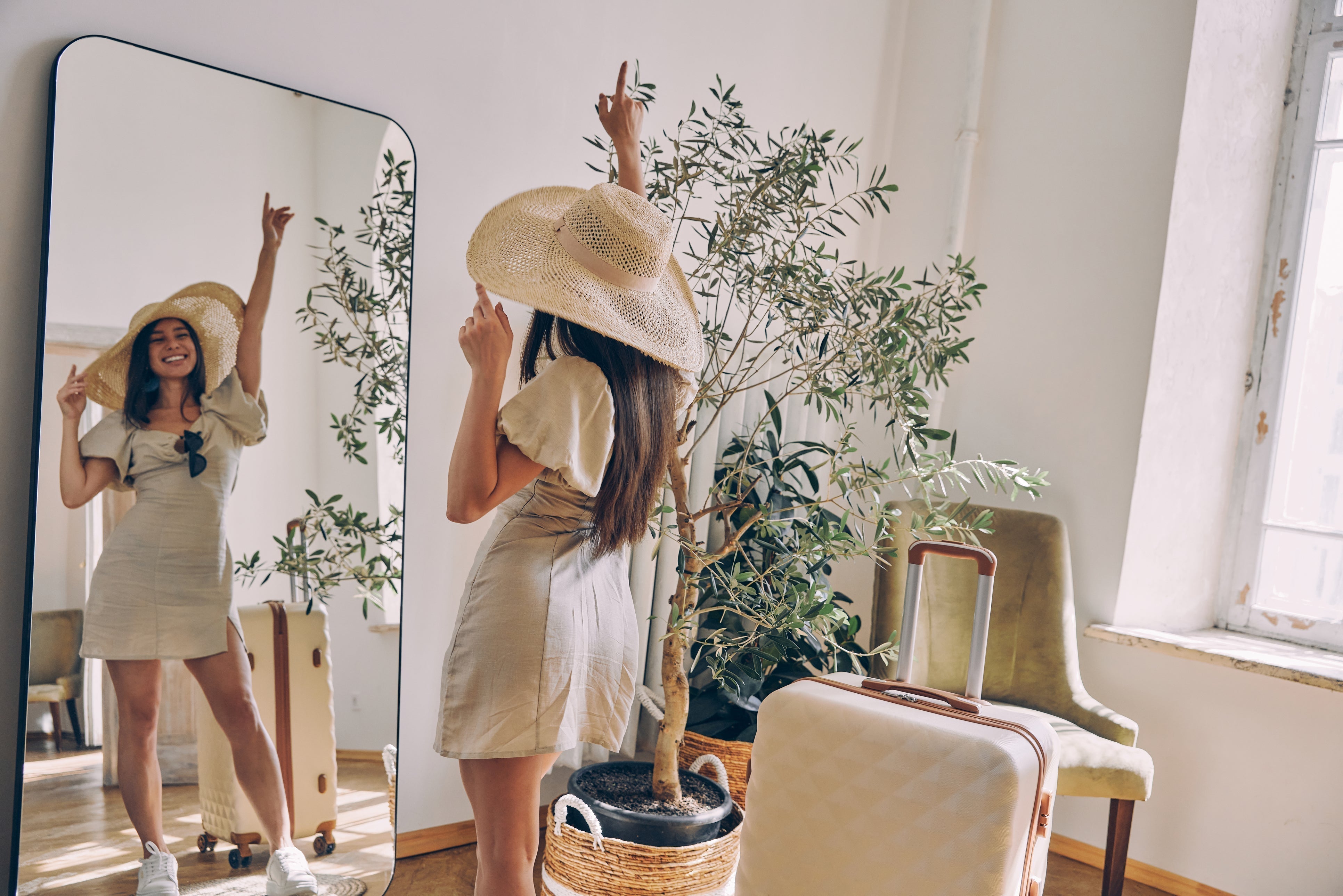 woman posing with summer clothes in the mirror